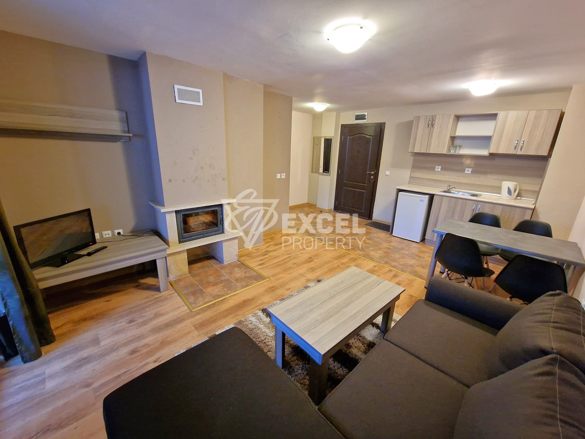 Двустаен апартамент с камина в целогодишно работещ комплекс за продажба в Банско