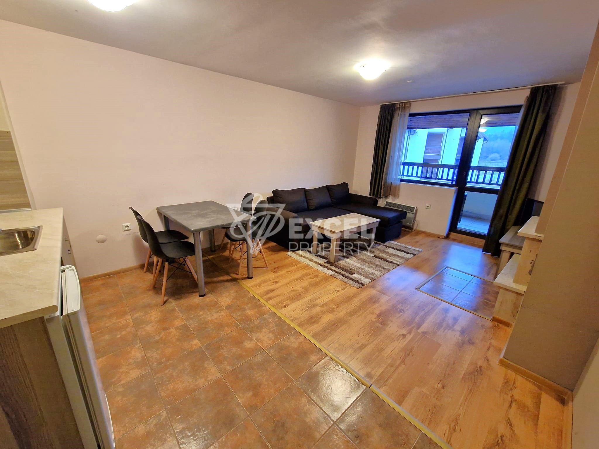 Двустаен апартамент с камина в целогодишно работещ комплекс за продажба в Банско