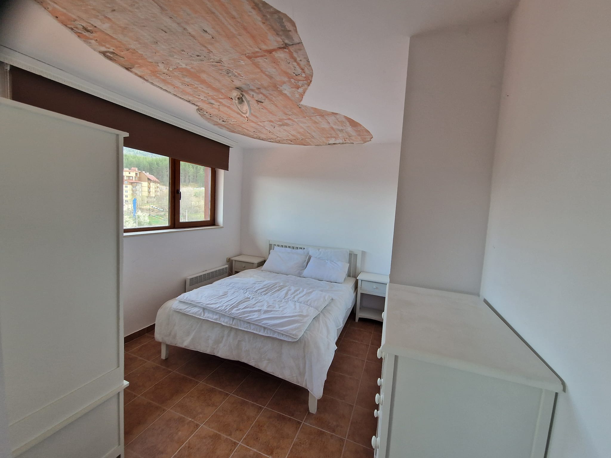 Източно студио с камина и ниска такса поддръжка за продажба в Банско