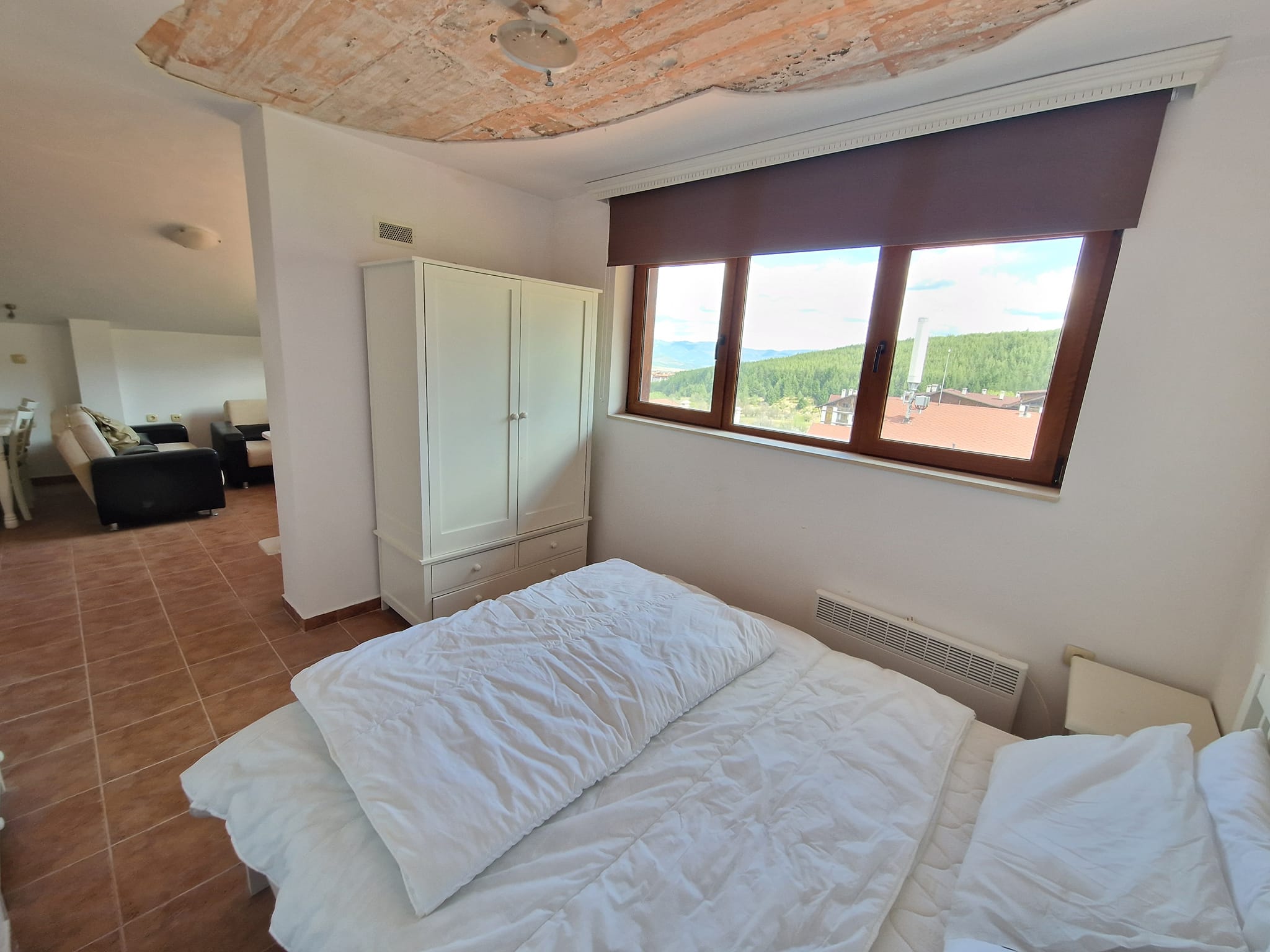 Източно студио с камина и ниска такса поддръжка за продажба в Банско